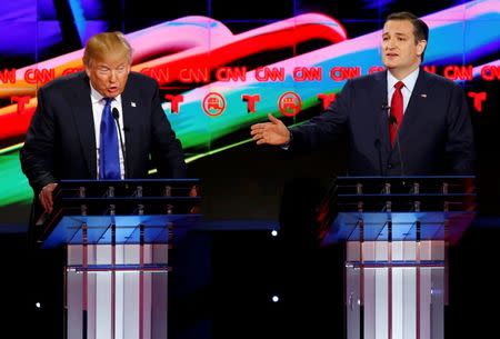 Republican U.S. presidential candidates Donald Trump (L) and Ted Cruz speak simultaneously as they discuss an issue during the debate sponsored by CNN for the 2016 Republican U.S. presidential candidates in Houston, Texas, February 25, 2016. REUTERS/Mike Stone