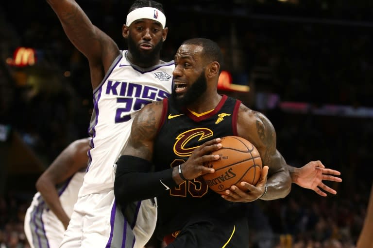 LeBron James of the Cleveland Cavaliers drives past JaKarr Sampson of the Sacramento Kings during the second half, at Quicken Loans Arena in Cleveland, Ohio, on December 6, 2017