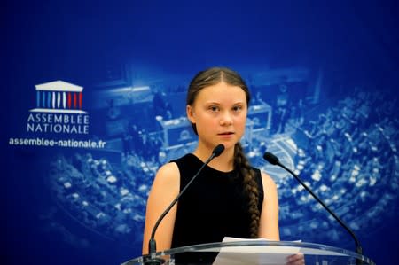 Swedish environmental activist Greta Thunberg delivers a speech before a debate with French parliament members at the National Assembly in Paris