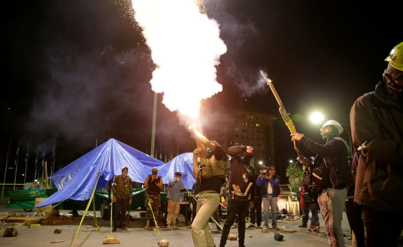 Members of Youth Resistance "Cochala" set off fireworks to celebrate after Bolivian Senator Jeanine Anez became interim president in La Paz