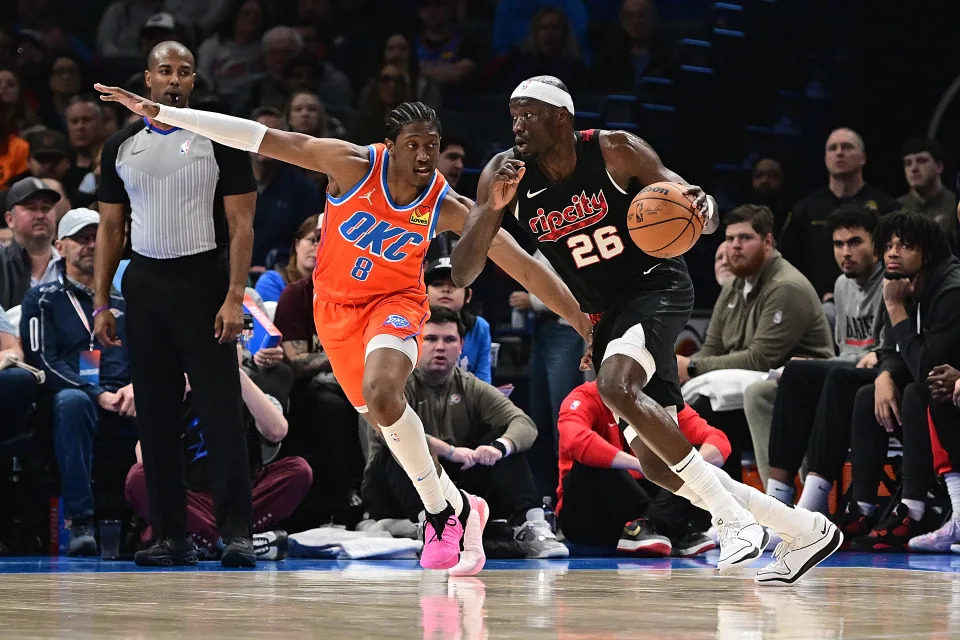 OKLAHOMA CITY, OKLAHOMA - JANUARY 23: Duop Reath #26 of the Portland Trail Blazers attempts to drive past Jalen Williams #8 of the Oklahoma City Thunder during the first half at Paycom Center on January 23, 2024 in Oklahoma City, Oklahoma. NOTE TO USER: User expressly acknowledges and agrees that, by downloading and or using this Photograph, user is consenting to the terms and conditions of the Getty Images License Agreement. (Photo by Joshua Gateley/Getty Images)