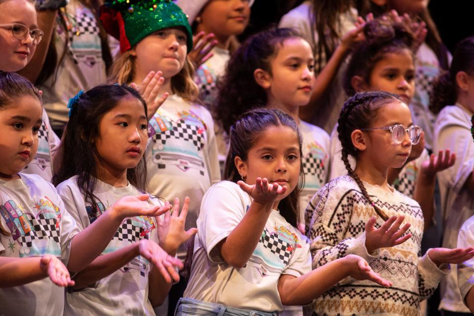 Webb Elementary School students sing and sign Christmas songs during an American Sign Language concert at Veterans Memorial High School, on Friday, Dec. 16, 2022, in Corpus Christi, Texas. 