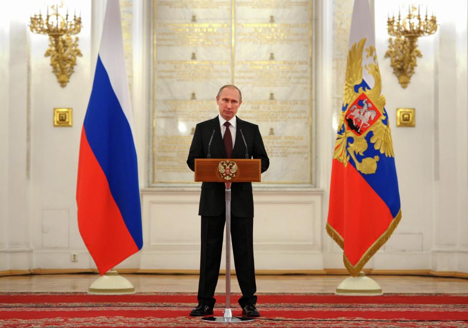 Russian President Vladimir Putin speaks at the presentation ceremony of the top military brass in the Kremlin in Moscow, Russia, Friday, March 28, 2014. Russia's president says Ukraine could regain some arms and equipment of military units in Crimea that did not switch their loyalty to Russia. (AP Photo/RIA-Novosti, Alexei Druzhinin, Presidential Press Service)