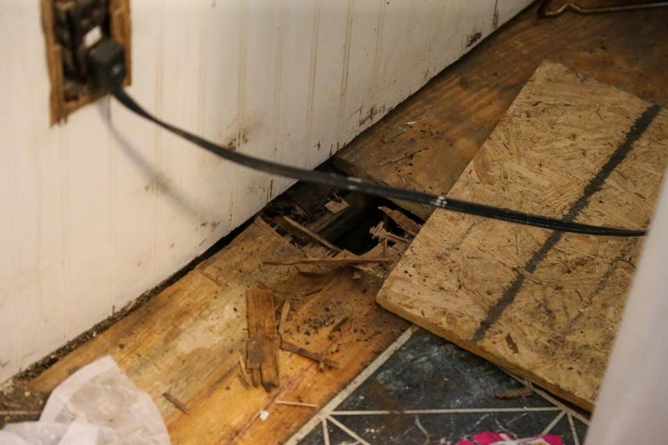 A hole in the floor of the house where Angela Moody and Randall Tanksely were renting from Chaofeng Liu, an adjunct professor at Purdue University in the Department of Statistics, on Monday, June 5, 2023, in Lafayette, Ind.