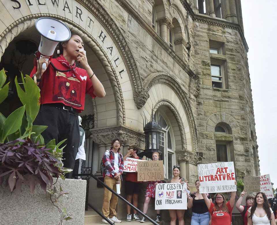 Mailyn Sandle speaks to the crowd at Stewart hall during a walkout by students in protest of an administration proposal to cut 9% of majors and amid a $45 million budget shortfall at West Virginia University in Morgantown, W.Va., Monday, Aug. 21, 2023. (Ron Rittenhouse /The Dominion-Post via AP)