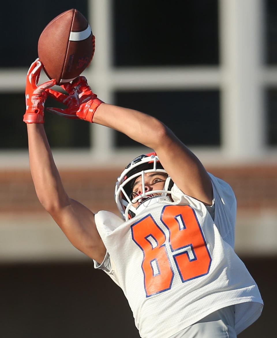 A San Angelo Central High School receiver tries to make a reception in the end zone during the first preseason practice at San Angelo Stadium on Monday, Aug. 8, 2022.