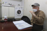 Kim Dal-sung, a pastor who vocally advocates for migrant workers' rights, speaks during an interview at his office in Pocheon, South Korea on Feb. 8, 2021. In the town near South Korea’s capital, hundreds of migrant workers from across Asia toil in silence, isolated and unprotected by labor laws. Activists and workers say migrant workers in Pocheon work 10 to 15 hours a day, with only two Saturdays off per month. They earn around $1,300-1,600 per month, well below the legal minimum wage their contracts are supposed to ensure. (AP Photo/Ahn Young-joon)