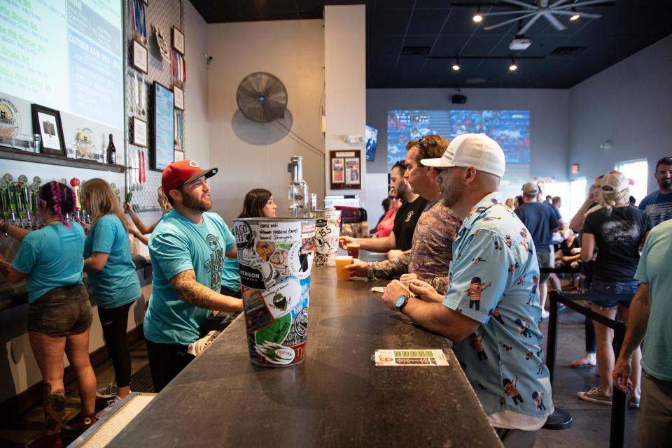 Customers sit at the bar at the Fort Myers Brewing Company.