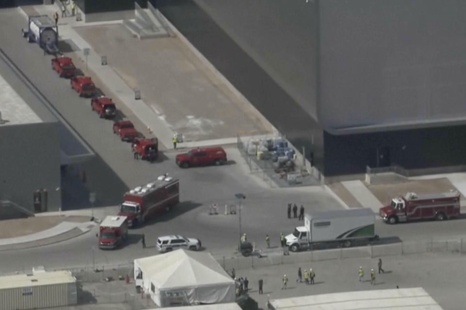 This image made from video provided by ABC15 shows emergency vehicles as they respond to the TSMC semiconductor plant under construction in Phoenix, Wednesday, May 15, 2024, after a worker was fatally injured when a tank holding waste material depressurized. He was struck and thrown over 20 feet. He died at a hospital from his injuries. (ABC15 via AP)