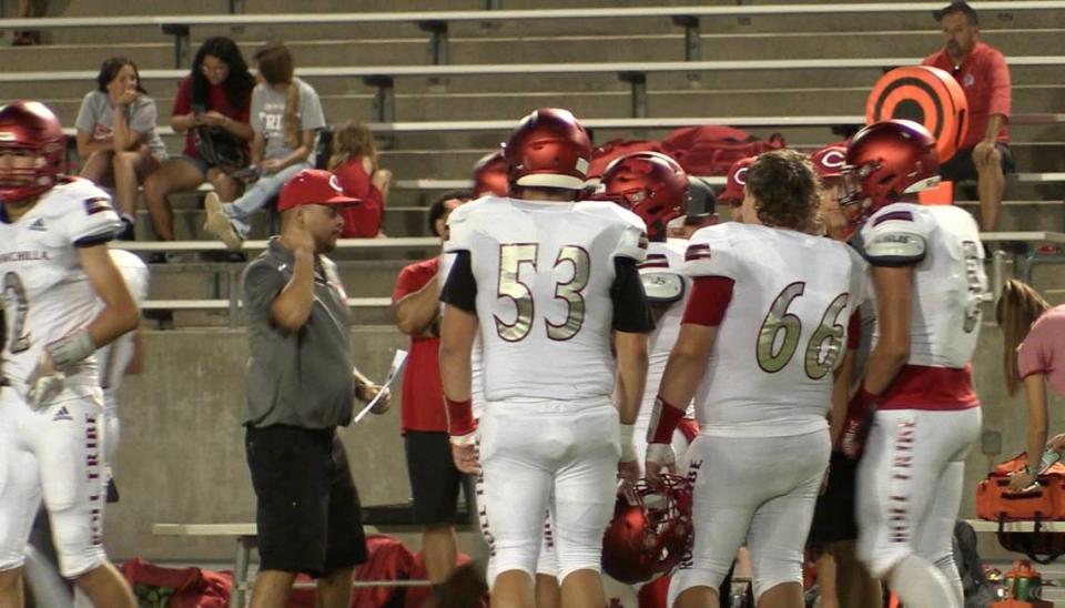 Chowchilla High talks on the sideline during its high school football game against Fresno on Friday, Aug. 25, 2023.