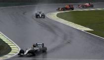 Formula One - F1 - Brazilian Grand Prix - Circuit of Interlagos, Sao Paulo, Brazil - 13/11/2016 - Mercedes' Lewis Hamilton of Britain (L) leads the pack early in the race. REUTERS/Paulo Whitaker