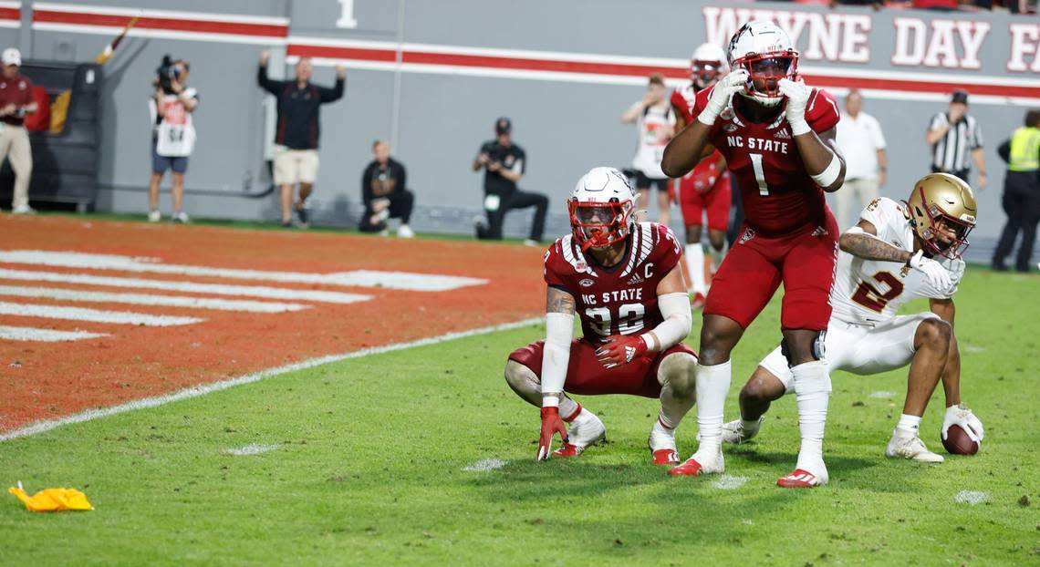 N.C. State linebacker Drake Thomas (32) and Isaiah Moore (1) react as a pass interference is called on Thomas late in the fourth quarter of Boston College’s 21-20 victory over N.C. State at Carter-Finley Stadium in Raleigh, N.C., Saturday, Nov. 12, 2022.