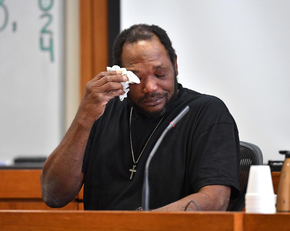 Stephen Lee, father of Darion Lee, wipes tears during his statement to Judge Thomas Krug during Darion Lee's sentencing hearing Wednesday, Jan. 3, 2024.