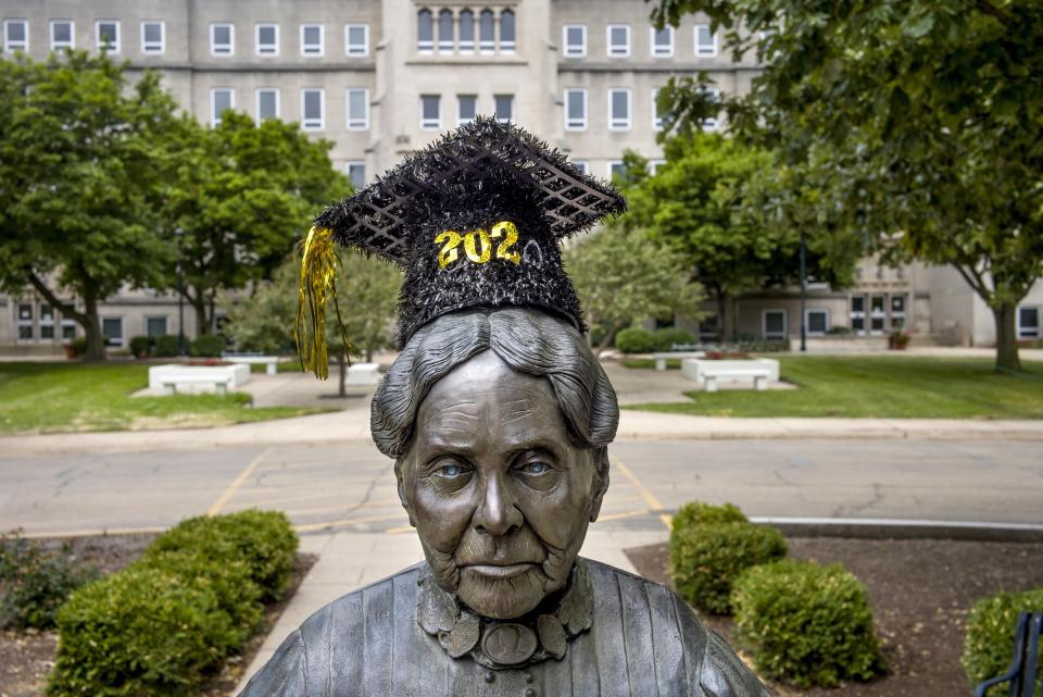 The statue of Bradley University founder Lydia Moss Bradley stands Monday, June 29, 2020 adorned with a Class of 2020 mortarboard.