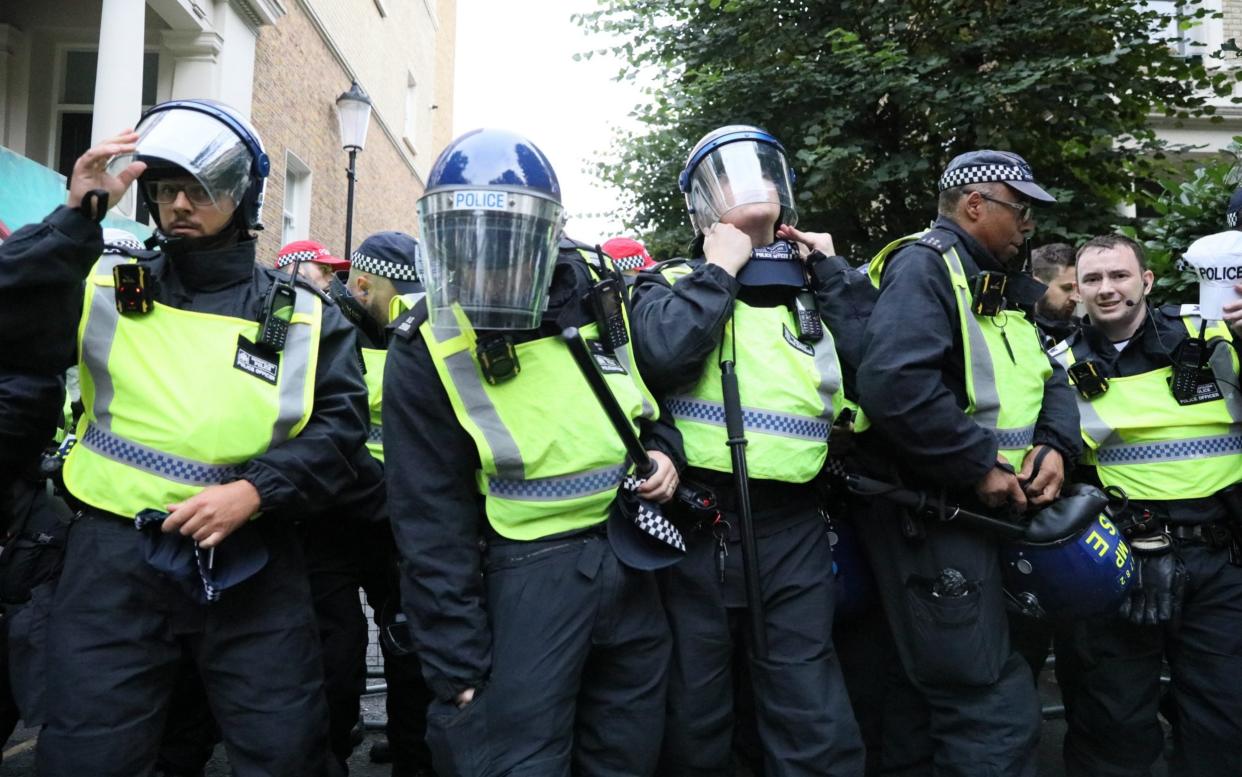 Police officers patrol the streets at Notting Hill Carnival