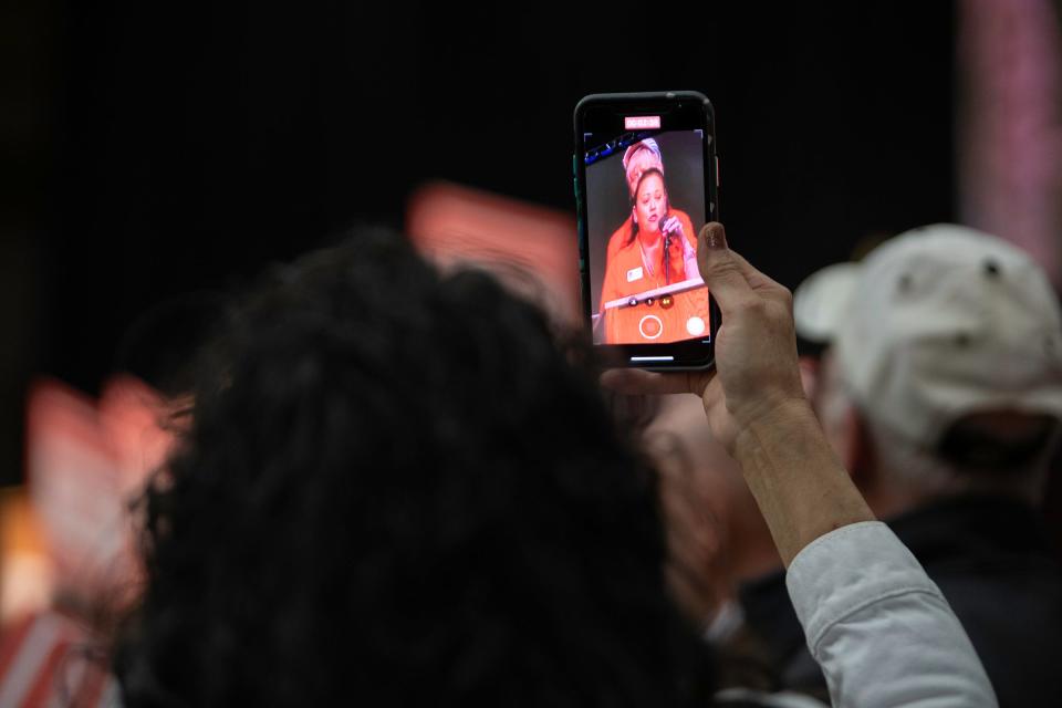 A supporter records Christy Fidura deliver a speech during the Colorado Republican Party's state assembly at the Southwest Motors Events Center on Saturday, April 6, 2024.