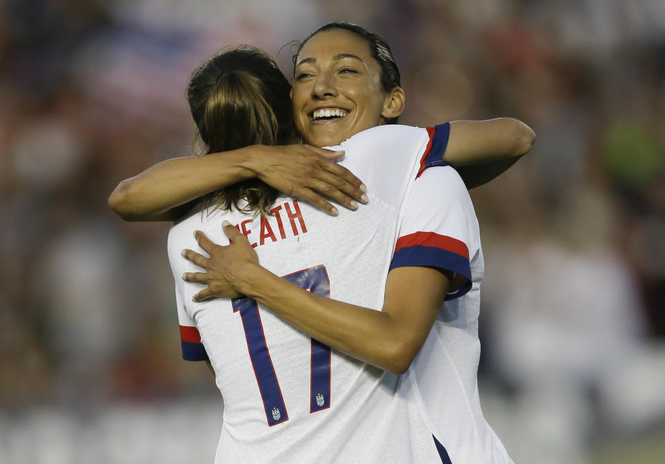 U.S.forward Christen Press hugs forward Tobin Heath, left, for Heath's goal against Ireland during the first half of an international friendly soccer match in Pasadena, Calif., Saturday, Aug. 3, 2019. (AP Photo/Alex Gallardo)