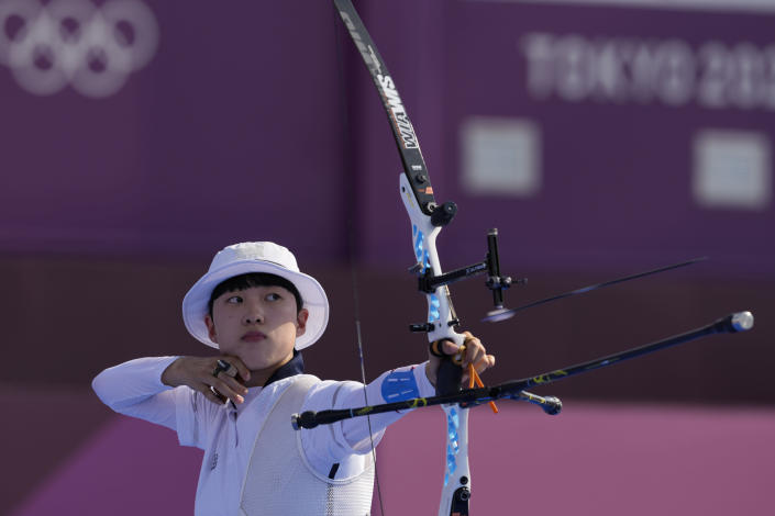 South Korea's An San releases an arrow during the mixed team competition at the 2020 Summer Olympics, Saturday, July 24, 2021, in Tokyo, Japan. (AP Photo/Alessandra Tarantino)