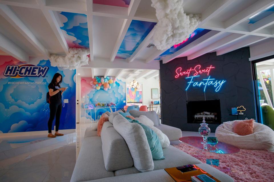 Joann Hsu, HI-CHEW senior brand marketing manager, stands inside the pop-up "HI-CHEW Fantasy House" during a tour for media in Palm Springs, Calif., on June 23, 2022. 