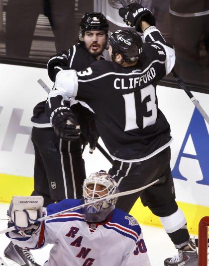 Doughty celebrates his goal on Rangers goalie Henrik Lundqvist with teammate Kyle Clifford during Game 1 of Stanley Cup Final in Los Angeles. (Reuters)