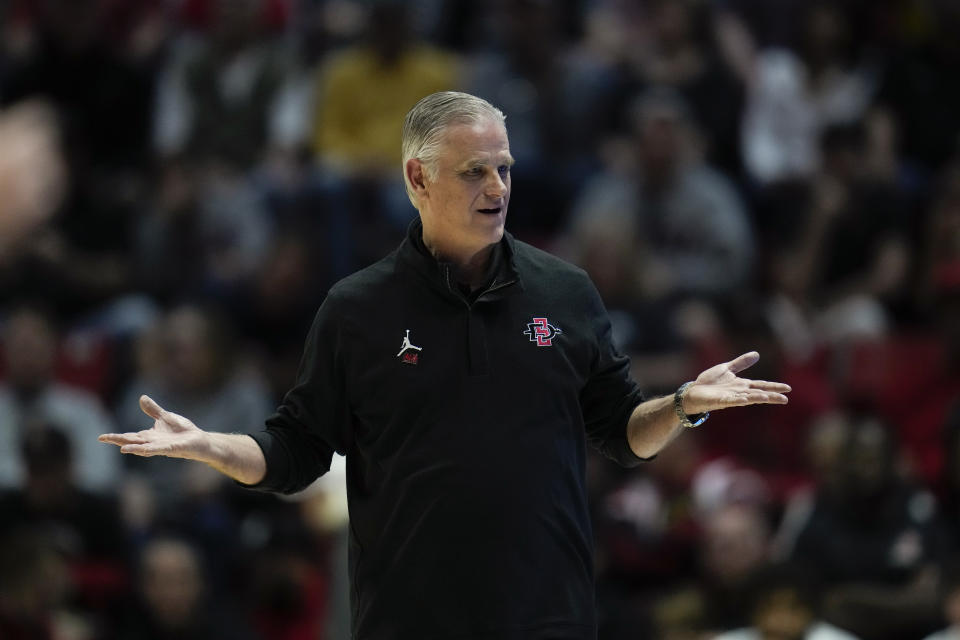San Diego State head coach Brian Dutcher reacts during the first half of an NCAA college basketball game against UNLV Saturday, Feb. 11, 2023, in San Diego. (AP Photo/Gregory Bull)