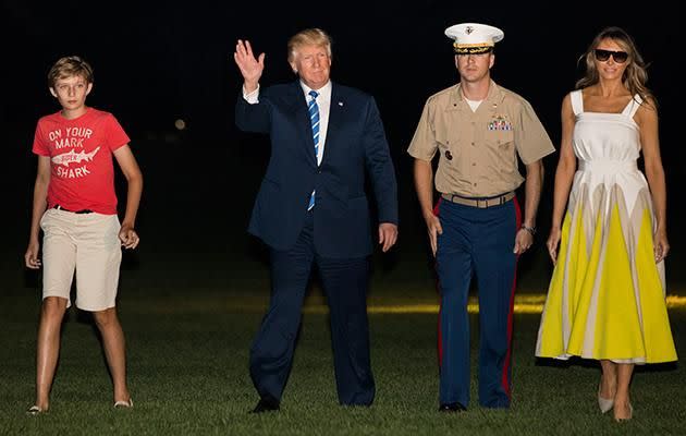 Barron looks just like any other 11-year-old on holiday with their parents. Photo: Getty Images