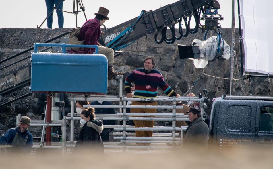 LYME REGIS, ENGLAND - OCTOBER 12: Timothée Chalamet is seen as Willy Wonka with director Paul King during filming for the Warner Bros and the Roald Dahl Story Company's upcoming movie 'Wonka' on October 12, 2021, in Lyme Regis, England. This film will focus on the young Willy Wonka on his earliest adventure and how he met the Oompa-Loompas. (Photo by Finnbarr Webster/Getty Images)