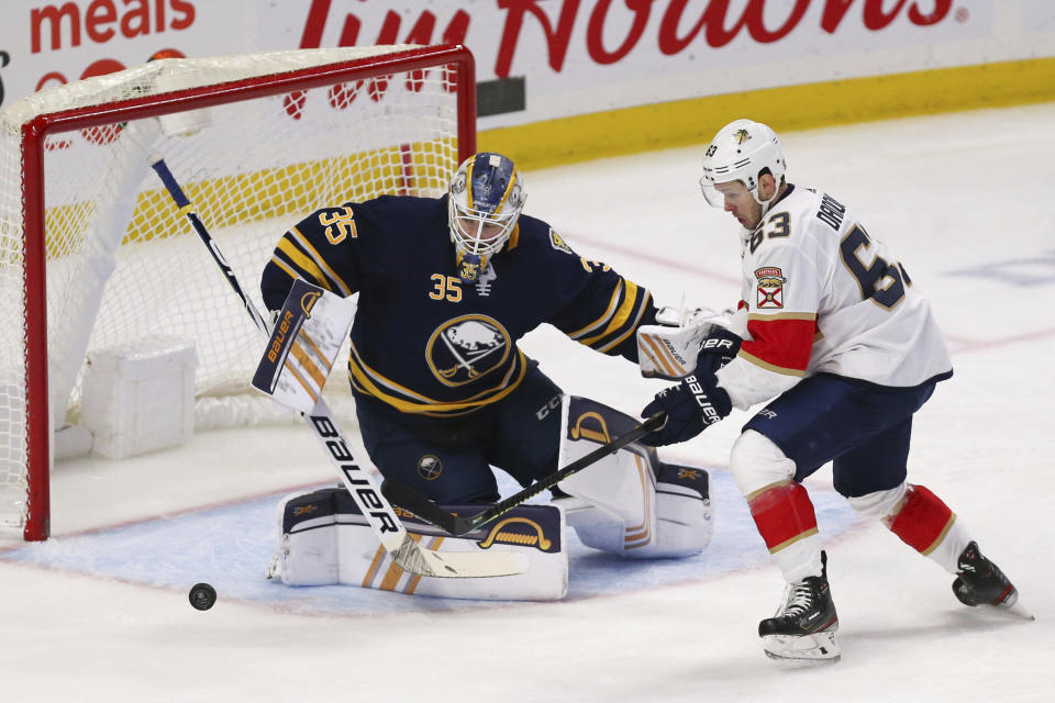 Buffalo Sabres goalie Linus Ullmark (35) stops Florida Panthers forward Evgenii Dadonov (63) during the first period of an NHL hockey game Saturday, Jan. 4, 2020, in Buffalo, N.Y. (AP Photo/Jeffrey T. Barnes)