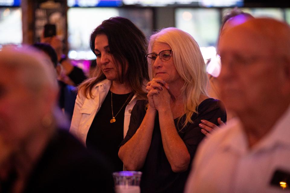From left, Michelle Lozano, hospital CEO of Oceans Healthcare, and Maggie Turner, chief of staff for Nueces County Judge Barbara Canales, watch as Canales concedes to challenger Connie Scott at her election night party at Little Woodrow's on Nov. 8, 2022, in Corpus Christi, Texas.