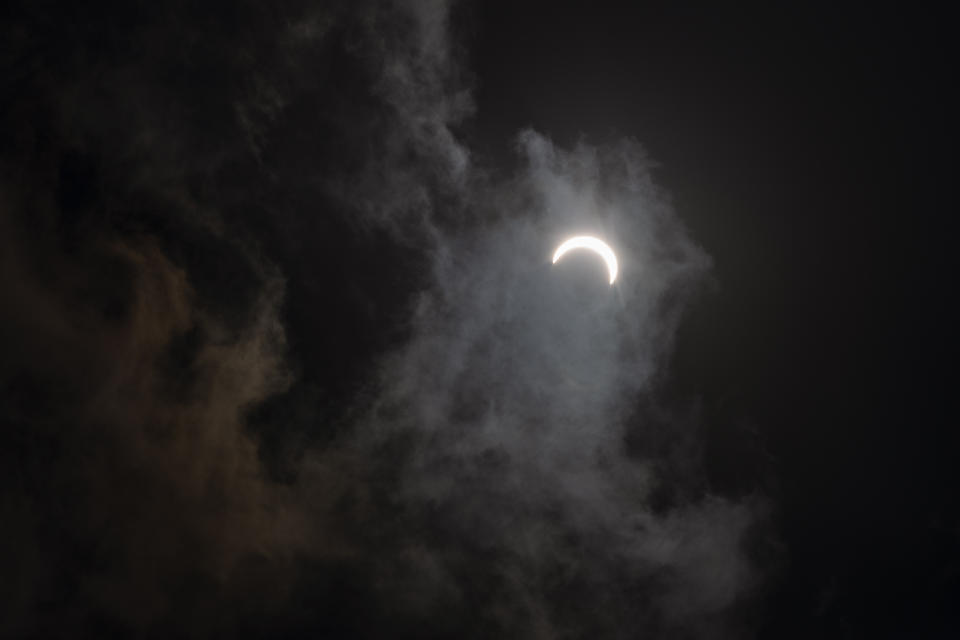 The crescent sun is seen during a solar eclipse in Dharmsala, India, Sunday, June 21, 2020. (AP Photo/Ashwini Bhatia)