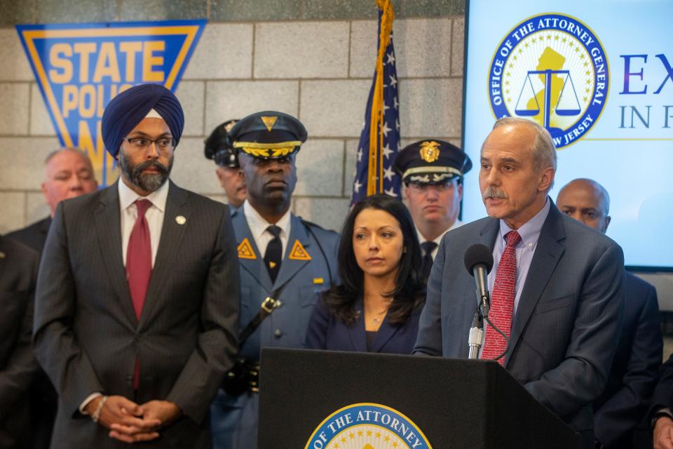 Thomas Eicher, director of Office of Public Integrity & Accountability, at right during a 2019 press conference.