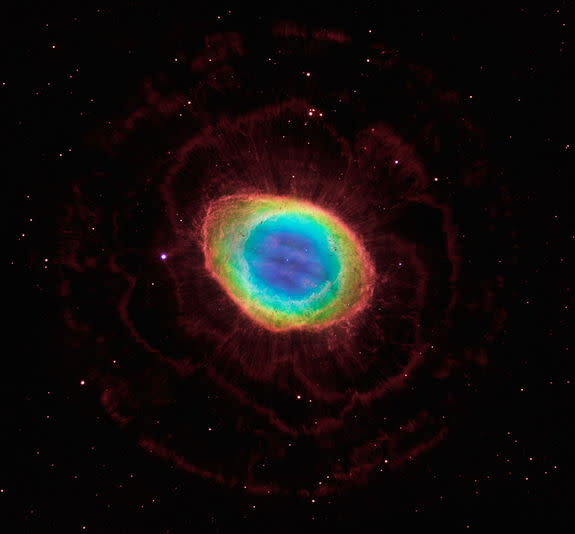 In this composite image, visible-light observations by NASA's Hubble Space Telescope are combined with infrared data from the ground-based Large Binocular Telescope in Arizona to assemble a dramatic view of the well-known Ring Nebula. Called a