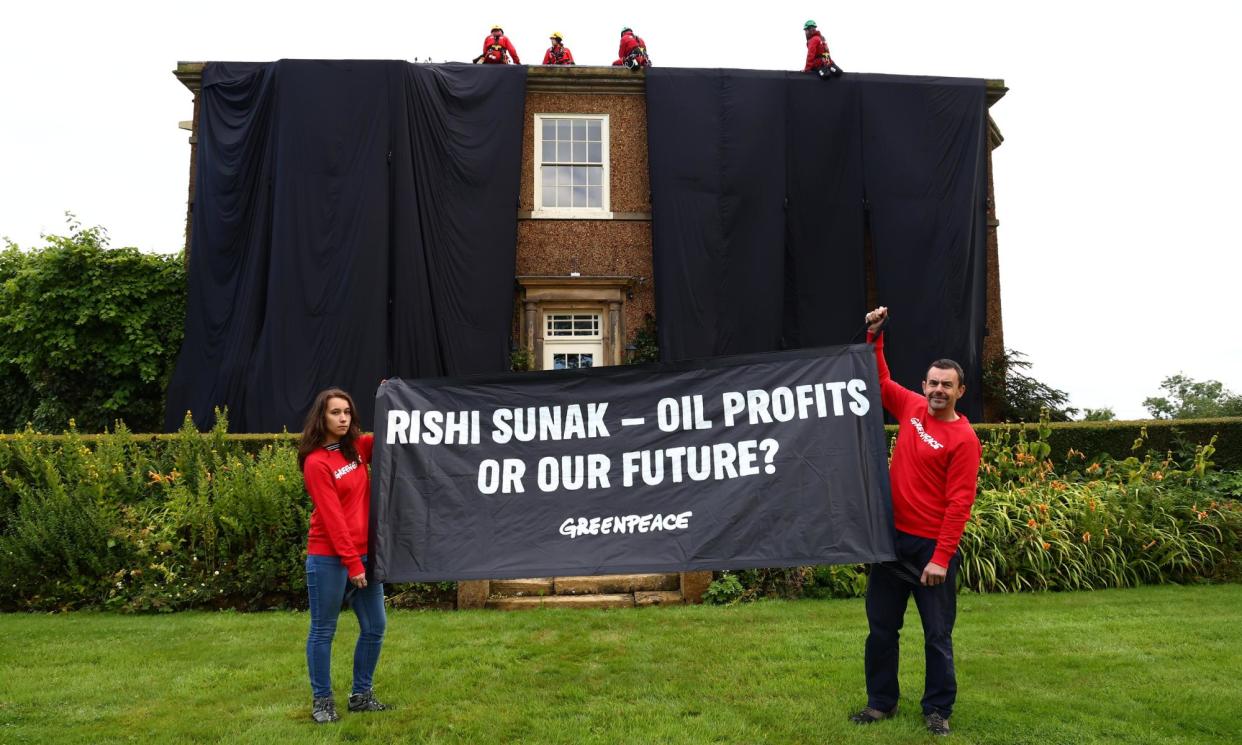 <span>Activists covered Rishi Sunak's mansion in oil black fabric in August last year.</span><span>Photograph: Greenpeace/Getty Images</span>