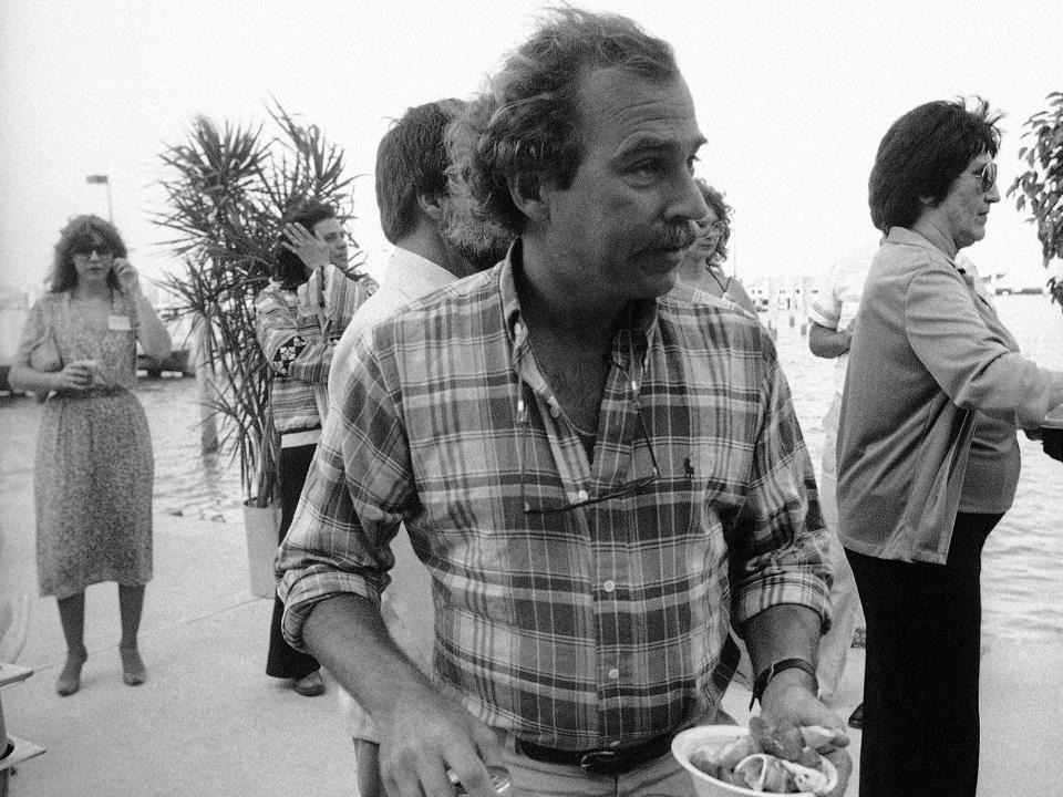 Singer Jimmy Buffett has a bowl of stone crabs at a Florida Audubon Society fundraiser for the Endangered Species Fund in Miami, March 20, 1983. Buffet, Chairman of Florida’s Save the Manatee Committee, was presented an award from the Audubon Society for his special efforts in saving endangered species from extinction.