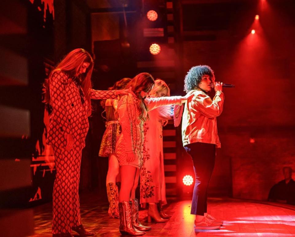 Alaina Watson, front, sings during the Nashville musical production, "She Believed She Could." The Alliance native was part of an all-female cast in a story about iconic female country music artists.