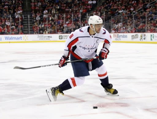 Washington's Alex Ovechkin makes the shot that produced his 700th career NHL goal on Saturday against the New Jersey Devils