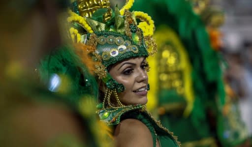 A reveller of "Unidos de Vila Maria" samba school performs during the second night of carnival in Sao Paulo