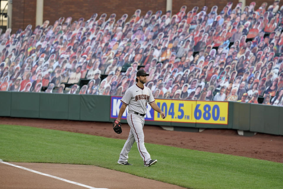 Arizona Diamondbacks starting pitcher Madison Bumgarner walks from the bullpen to the dugout before the team's baseball game against the San Francisco Giants on Saturday, Sept. 5, 2020, in San Francisco. (AP Photo/Eric Risberg)