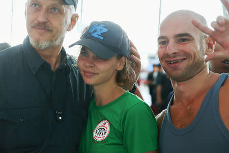 Anastasia Vashukevich (C), a Belarusian model and escort who caused a stir last year after she was arrested in Thailand and said she had evidence of Russian interference in the 2016 U.S. presidential election, is pictured before being deported at Bangkok's International airport, Thailand, January 17, 2019. REUTERS/Athit Perawongmetha