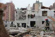 <p>Rescue workers are seen at the site of an explosion in Ningbo, China’s eastern Zhejiang province on Nov. 26, 2017. (Photo: STR/AFP/Getty Images) </p>