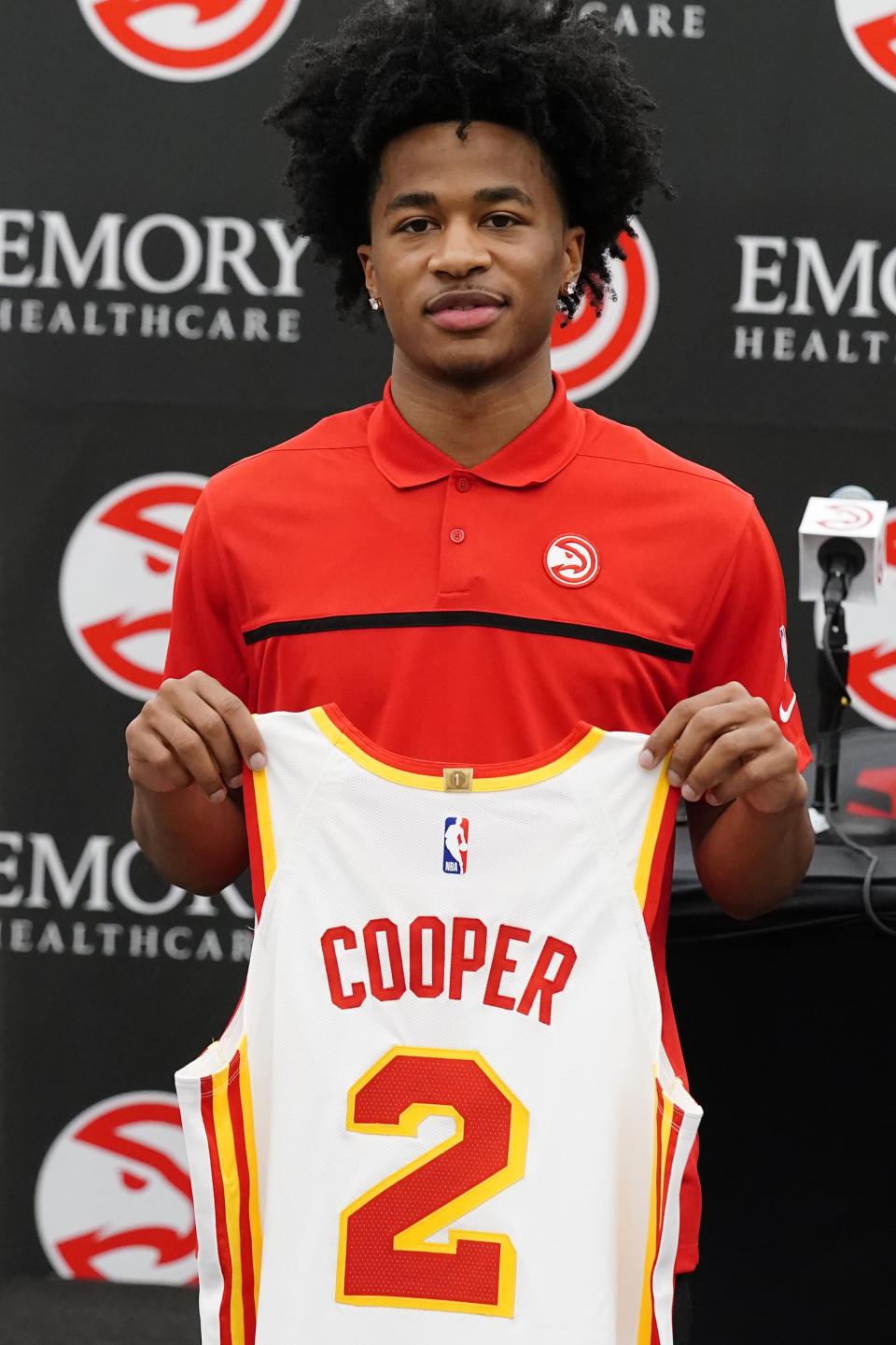 Atlanta Hawks NBA basketball draft pick Sharife Cooper poses for photos after a news conference Friday, July 30, 2021, in Atlanta. (AP Photo/John Bazemore)