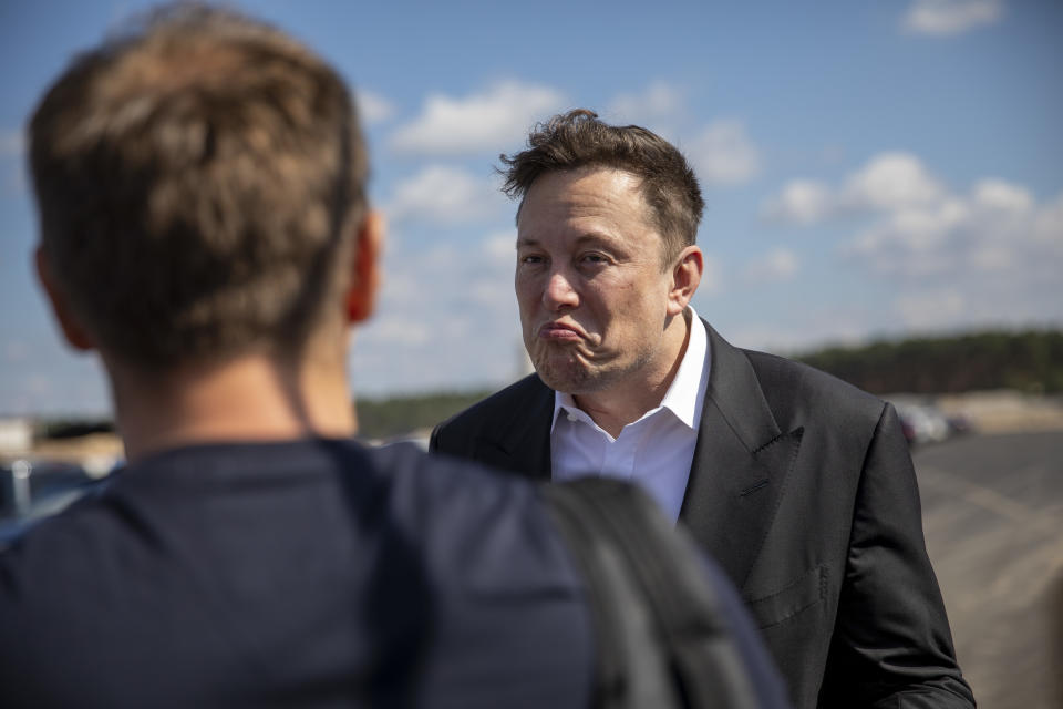 GRUENHEIDE, GERMANY - SEPTEMBER 03: Tesla head Elon Musk talks to one visitor as he arrives to to have a look at the construction site of the new Tesla Gigafactory near Berlin on September 03, 2020 near Gruenheide, Germany. Musk is currently in Germany where he met with vaccine maker CureVac on Tuesday, with which Tesla has a cooperation to build devices for producing RNA vaccines, as well as German Economy Minister Peter Altmaier yesterday. (Photo by Maja Hitij/Getty Images)