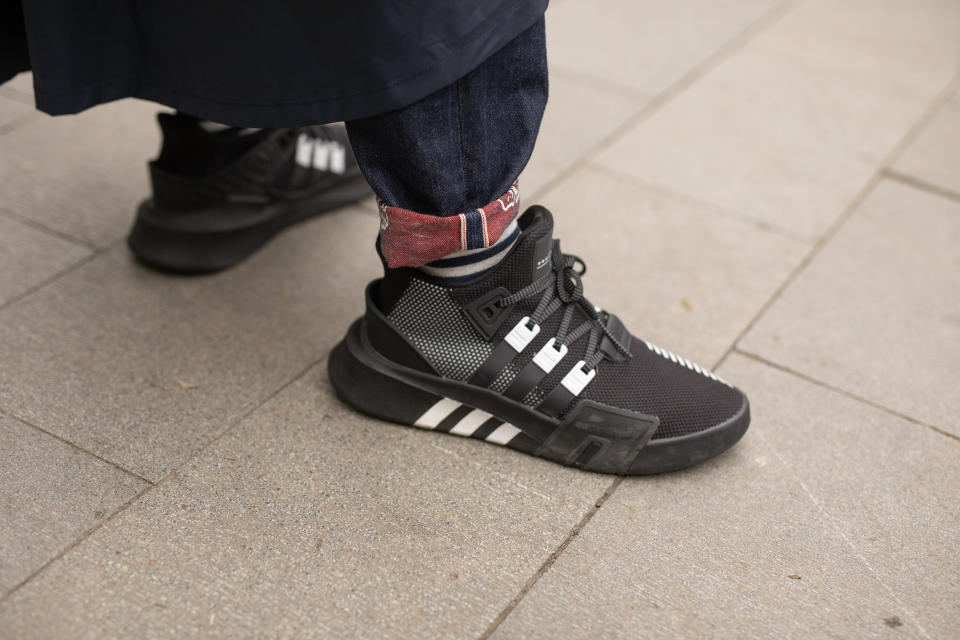 SHANGHAI,CHINA - APRIL 2: A guest is seen on the street attending Shanghai Fashion Week A/W 2019/2020 wearing Adidas sneakers on April 2, 2019 in Shanghai, China (Photo by Matthew Sperzel/Getty Images)