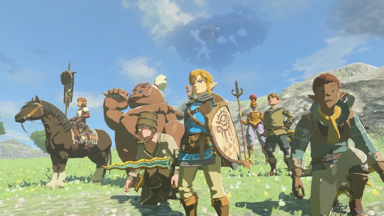  Link stands alongside his allies, holding a beige shield and wearing a blue tunic 