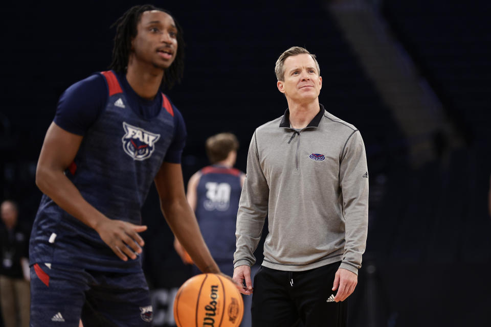 Florida Atlantic head coach Dusty May looks on as Michael Forrest, left, prepares to shoot during practice before a Sweet 16 college basketball game at the NCAA East Regional of the NCAA Tournament, Wednesday, March 22, 2023, in New York. (AP Photo/Adam Hunger)