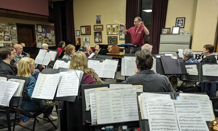 Bill Hollin directs the Rohrersville Cornet Band during a recent rehearsal.