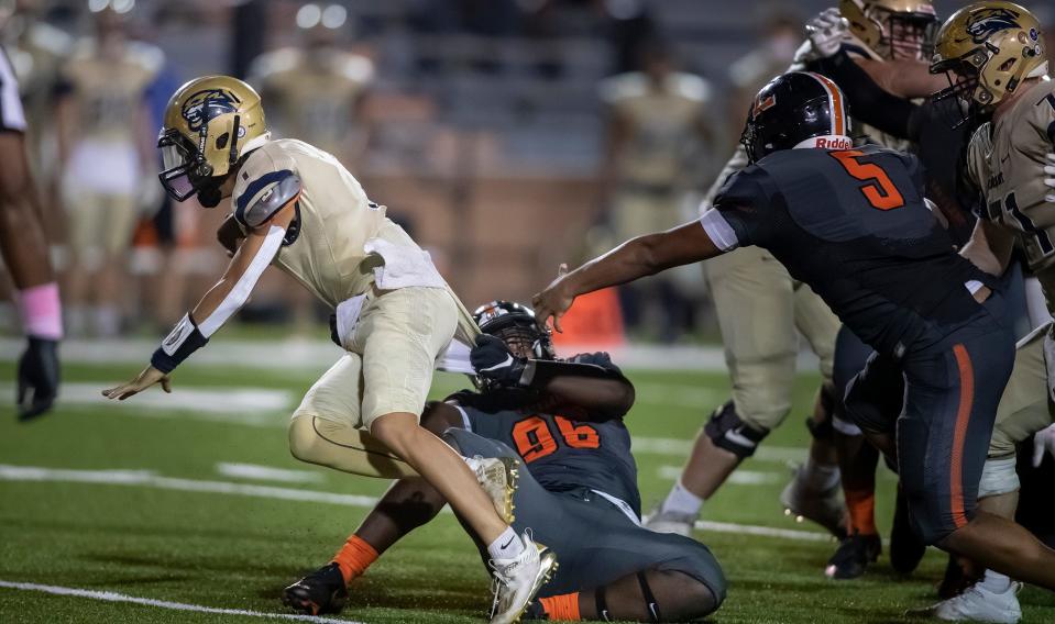Lakeland Dreadnaughts Guerlens Milfort (96) stops Durant quarterback Marcus Miguele (1)  during first half action in Lakeland Fl. Friday October 16, 2020. ERNST PETERS/ THE LEDGER