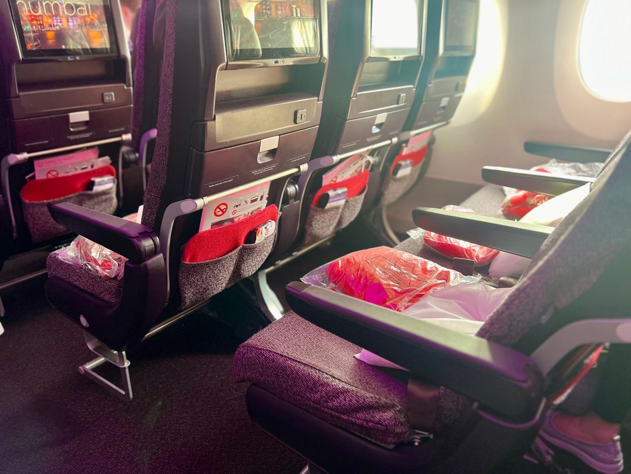 The seats on Virgin with linens.