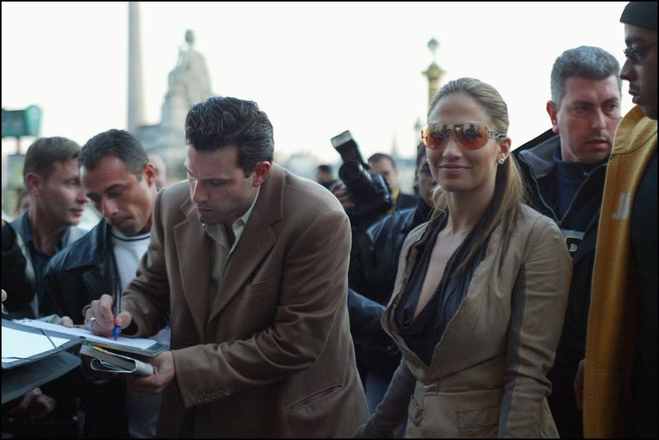 <p>Lopez and Affleck signing autographs in Paris on April 8, 2003.</p>