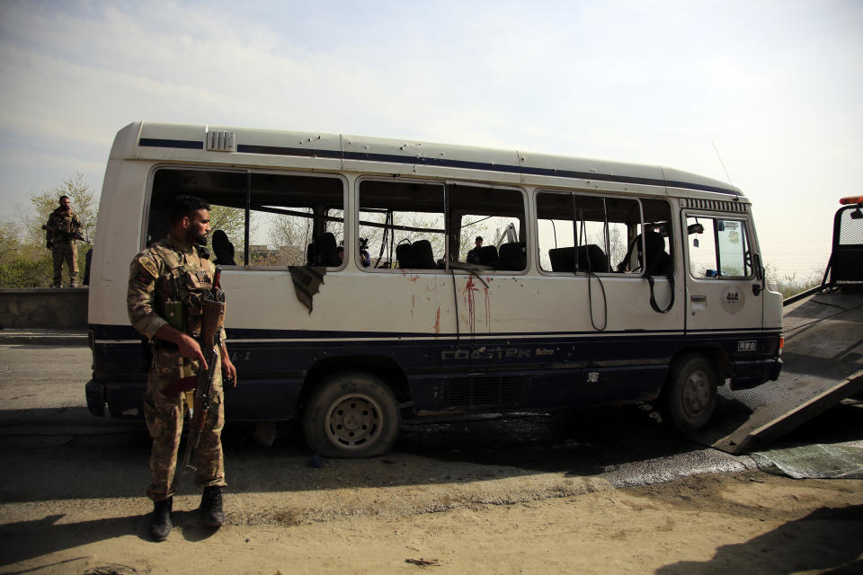 Security personnel arrive at the site of a bomb explosion in Kabul, Afghanistan, Thursday, March 18, 2021. The bus attack caused numerous deaths and injuries according to police. (AP Photo/Mariam Zuhaib)